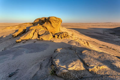 Scenic view of desert against clear sky