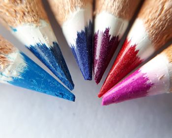 Close-up of multi colored pencils on table