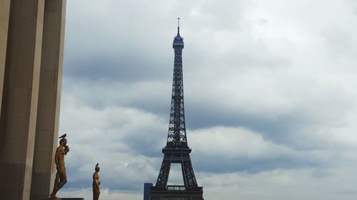 Low angle view of monument against cloudy sky