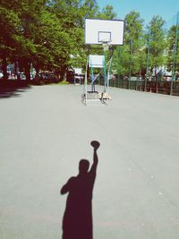 Shadow of basketball hoop