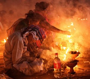 Doing prayer at barodi lokhnath brahmachari ashram infront of burning candle oil lamp