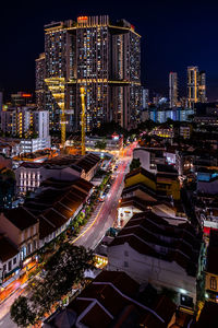 High angle view of illuminated buildings in city at night