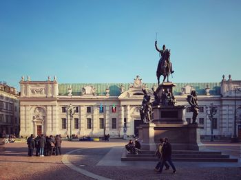 People in front of historic building