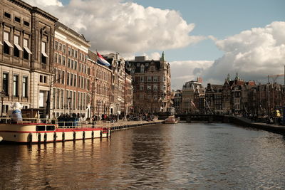 Boats in river in city