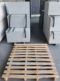 High angle view of empty chairs on footpath