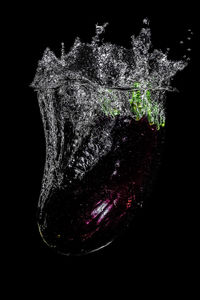 Close-up of berries over black background