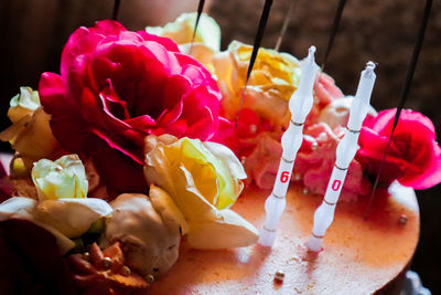 Close-up of multi colored roses on table