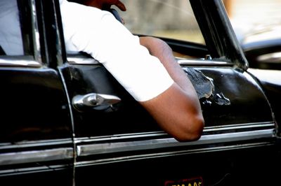 Close-up of man driving car