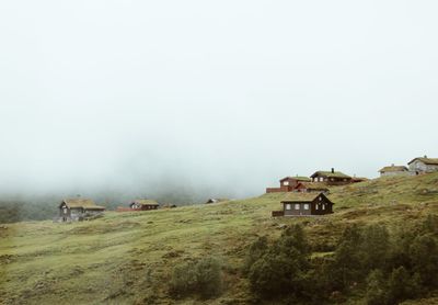 House on field against sky