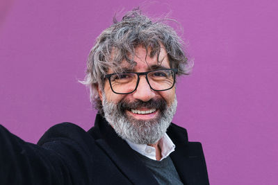 Portrait of young man against white background