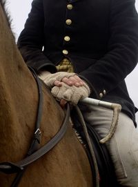 Midsection of man with horse