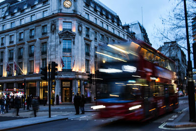 Blurred motion of people in city at night