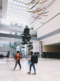 People walking on building in city