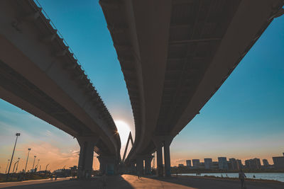 Low angle view of elevated road against sky