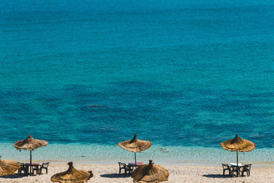 Scenic view of beach against blue sky