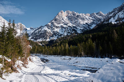 Scenic view of snowcapped mountains against sky
