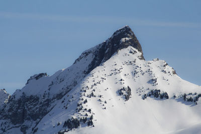 Scenic view of snow covered mountain against sky