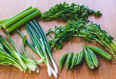 High angle view of healthy green vegetables on wooden table