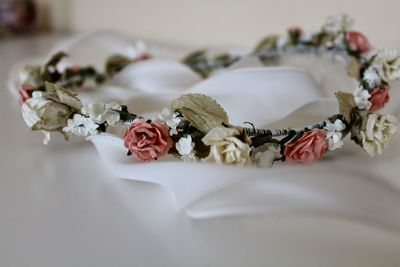 Close-up of rose wreath on table