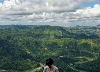 Man on mountain against landscape
