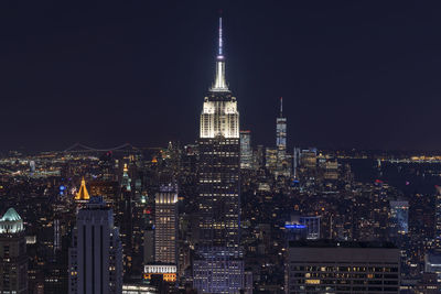 Illuminated buildings in city at night