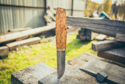 Close-up of wooden post on table
