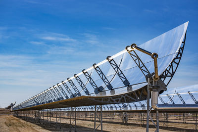 Low angle view of metallic structure against sky