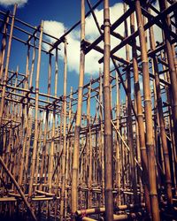 Low angle view of scaffoldings against sky