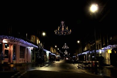 Illuminated street lights at night