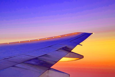 Cropped image of airplane flying in sky