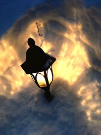 Low angle view of silhouette man against sky during sunset