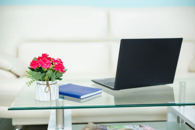 Close-up of flower vase on table