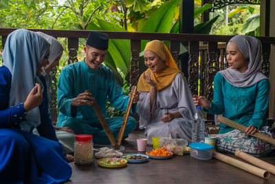 Group of people sitting on table