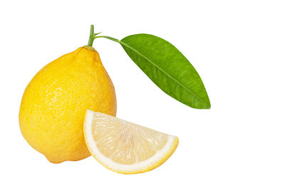 Close-up of lemon slice against white background