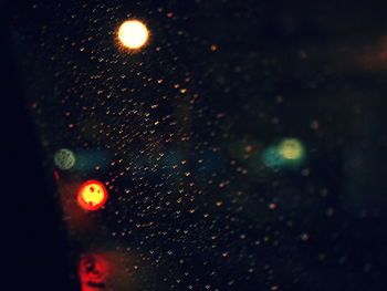 Close-up of wet glass window in rainy season