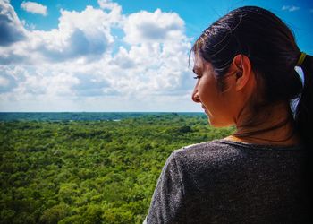 Portrait of young woman looking at sea