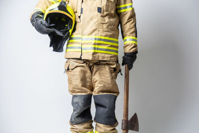 Rear view of man standing against white background