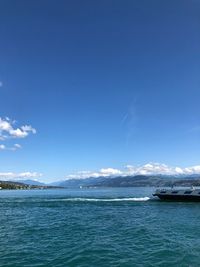 Scenic view of sea against blue sky