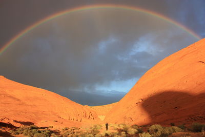 Rainbow over mountain against sky