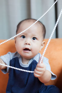 Close-up of a boy with rope