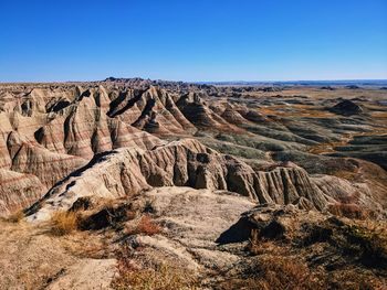 Scenic view of rocky mountains against clear sky