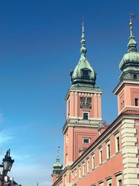 Low angle view of building against blue sky