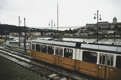 Train against sky in city