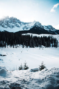 Scenic view of snow covered mountains against sky