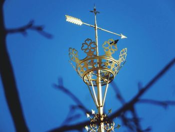 Low angle view of lamp post against blue sky