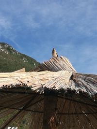 Low angle view of house roof against sky