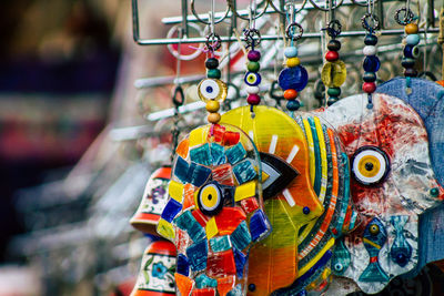 Close-up of multi colored dreamcatchers hanging for sale in market