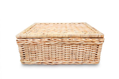 Close-up of wicker basket on white background