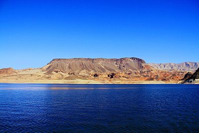 Scenic view of mountains against clear blue sky