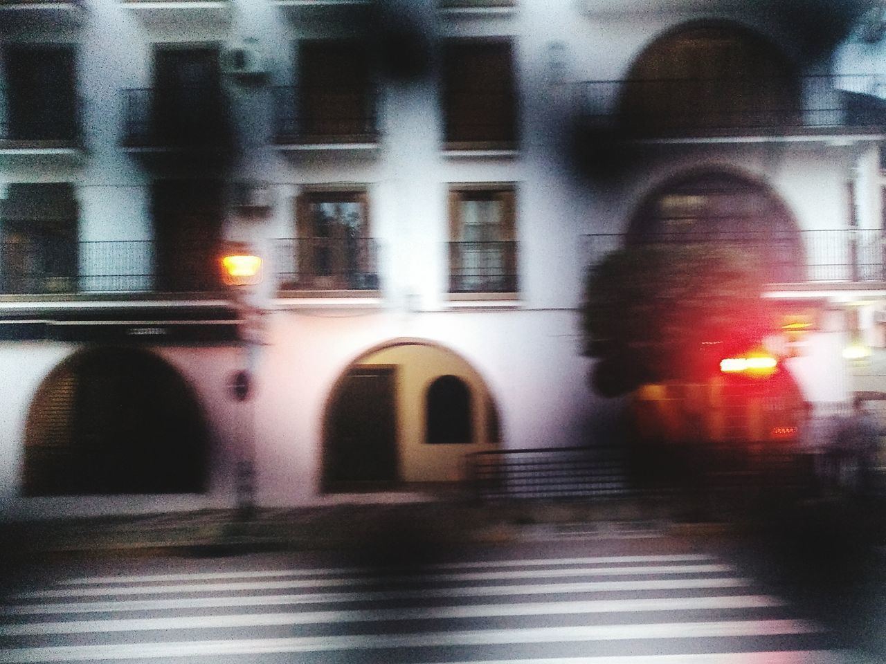 BLURRED MOTION OF ILLUMINATED STREET AT NIGHT